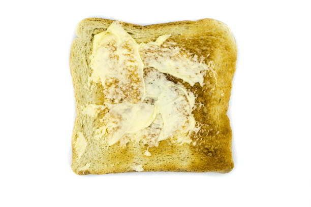 istock Toast bread with butter isolated on white background 1316975348