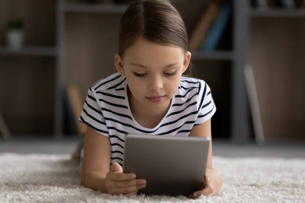 istock Smart ten girl child use modern pad at home 1316977269