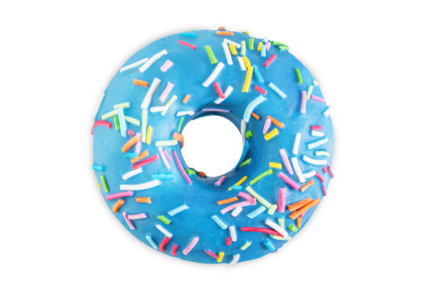 Blue donut with sprinkles on a white isolated background Blue donut with sprinkles on a white isolated background. toning. selective focus donuts stock pictures, royalty-free photos & images