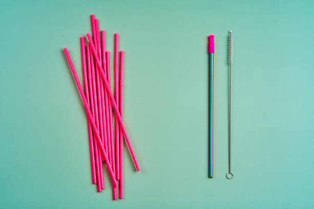 istock The modern trend towards caring for the environment. A pack of pink plastic beverage straws versus one reusable beverage straw with cleaning brushes 1316980097