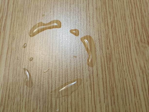 istock Water stains on wood background 1316980178