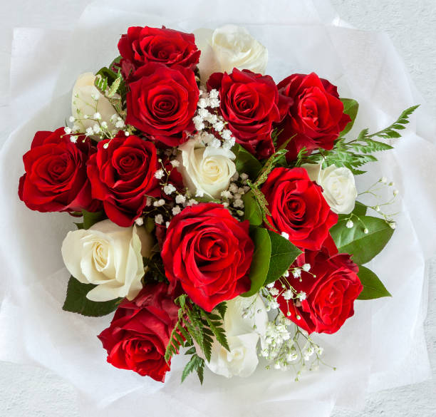 istock White and red rose with green leaf bouquet isolated on white background top view flat lay 1316980838