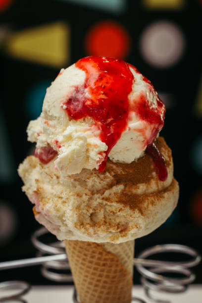 istock Ice cream cone with vanilla, cinnamon and strawberry 1316986831