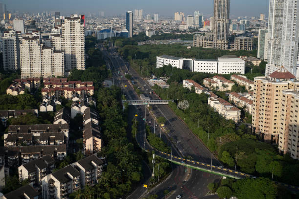 istock Jakarta With Mountain Background taken from Wisma Atlet 1316991146