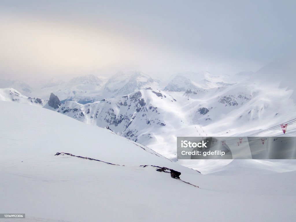 Fresh tracks on the snow slopes in Lenzerheide early in the morning Arosa Stock Photo