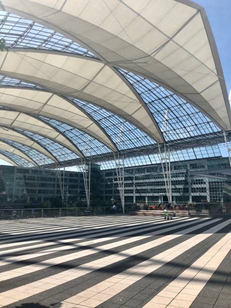 Modern architecture in Munich Airport during a sunny day Munich, Germany - May 28, 2018: Modern architecture in Munich Airport during a sunny day munich airport stock pictures, royalty-free photos & images