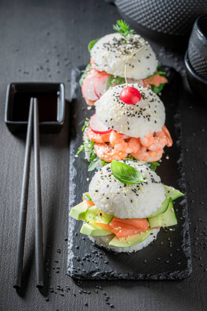istock Delicious sush burger with seafood and vegetables sprinkled with sesame. 1316994668