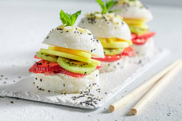 Exquisite sush burger with mascarpone and strawberries sprinkled with sesame.