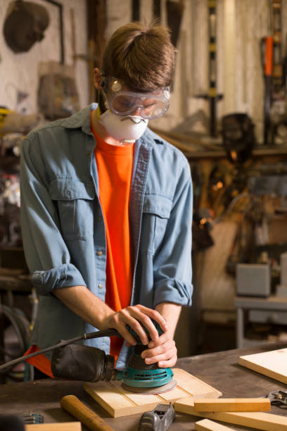istock Young adult Caucasian male working in small workshop. 1316995792