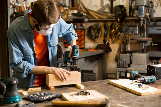 istock Young adult Caucasian male working in small workshop. 1316995832