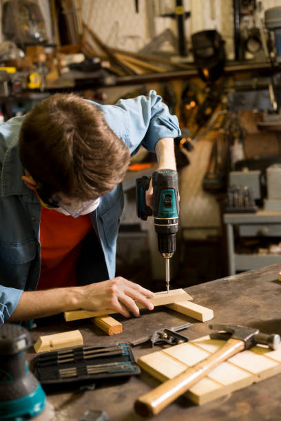 istock Young adult Caucasian male working in small workshop. 1316995841
