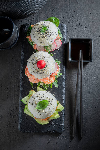 istock Unique sush burger with seafood and vegetables sprinkled with sesame. 1316995867