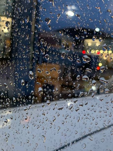 istock Rain waters on a glass surface unique photo 1316999823