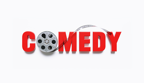 Film reel forming the comedy word on white background. Horizontal composition with clipping path and copy space. Directly above. Comedy movie genre concept.