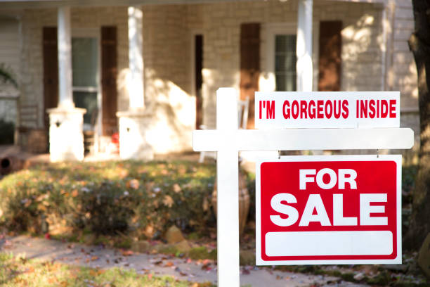 istock Home for sale with real estate sign.  Front yard. 1317001392