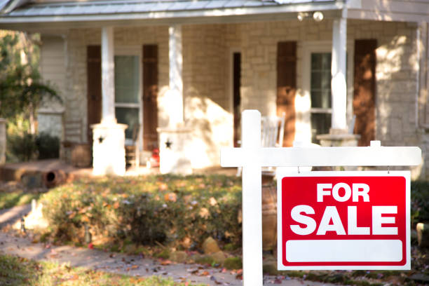 istock Home for sale with real estate sign.  Front yard. 1317001421