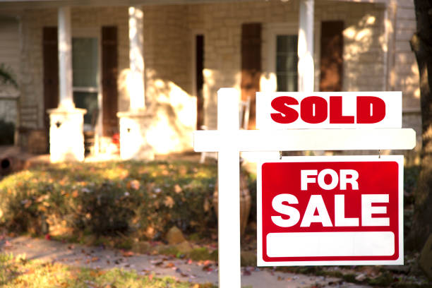 istock Home for sale with real estate sign.  Front yard. 1317001680
