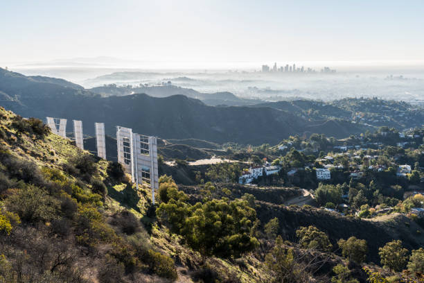 Los Angeles, California, USA - December 13, 2018:  Hazy morning view towards downtown LA from behind the Hollywood Sign in popular Griffith Park.