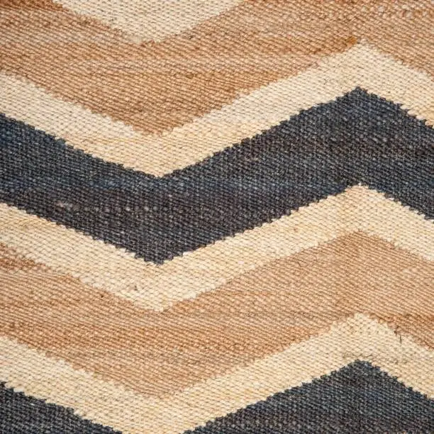 Photo of Chevron jute rug texture close up, can be used as background