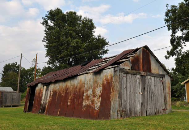 Barn at Mickey Mantle's boyhood home in Commerce, Oklahoma Commerce, OK, USA, Oct. 5, 2019: The rusting old barn at baseball great Mickey Mantle's boyhood home in the Route 66 city of Commerce, Oklahoma. Mantle used the shed as a backstop as he practiced his swing. mickey mantle stock pictures, royalty-free photos & images