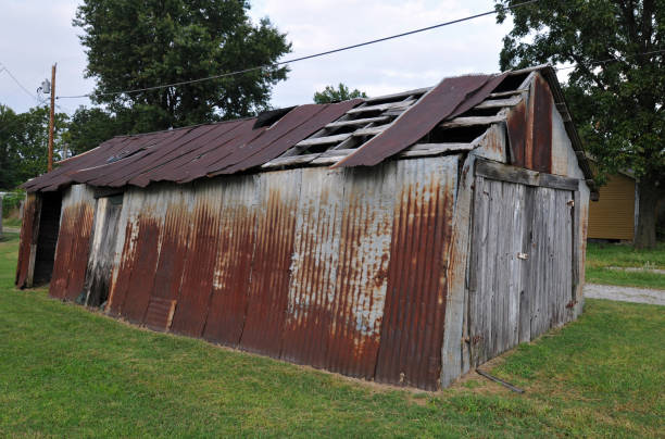 Barn at childhood home of baseball great Mickey Mantle Commerce, OK, USA, Oct. 5, 2019: The rusting old barn at baseball great Mickey Mantle's boyhood home in the Route 66 city of Commerce, Oklahoma. Mantle used the shed as a backstop as he practiced his swing. mickey mantle stock pictures, royalty-free photos & images