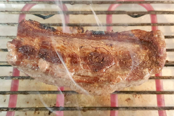 Man cooking barbecue - filtered image
