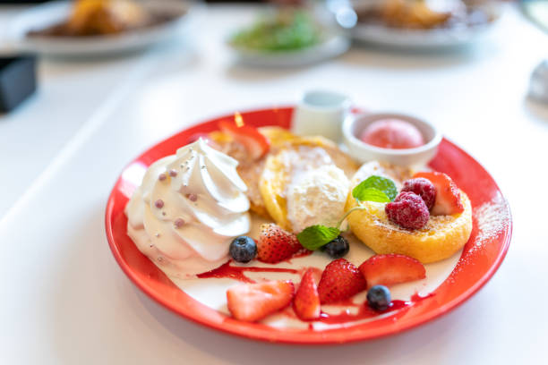 Dessert plate with fresh fruit, pancake, fresh cream, gelato