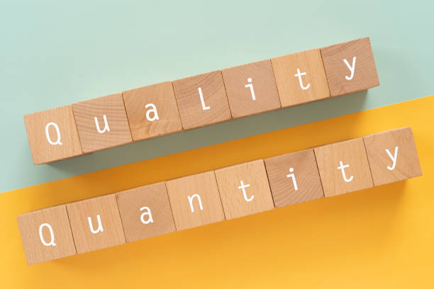 istock Quality and quantity; Wooden blocks with 
