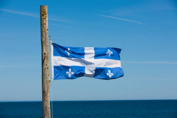 istock Quebec Provincial flag on wooden pole. 1317031798