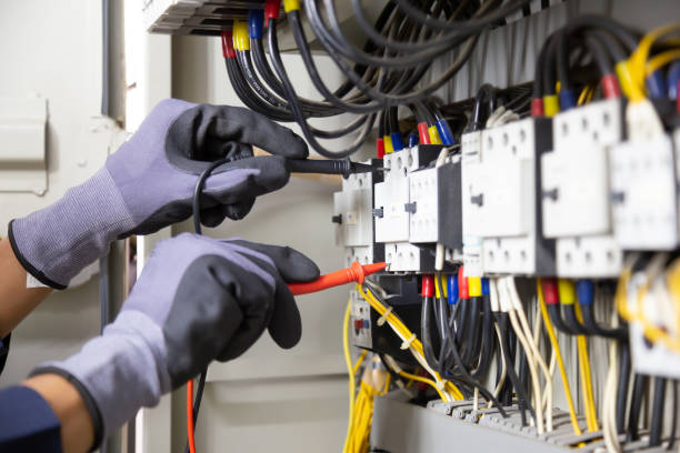 istock Electrician engineer tests electrical installations and wires on relay protection system. Adjustment of scheme of automation and control of electrical equipment. 1317036282