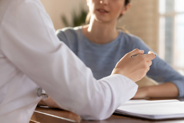 istock Close up young female general practitioner gesturing, communicating with patient. 1317036312