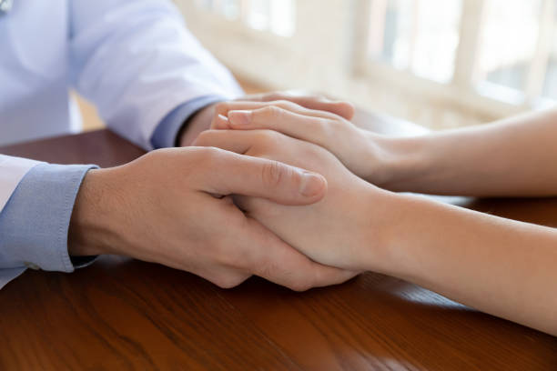 istock Close up compassionate male gp doctor supporting patient. 1317036387