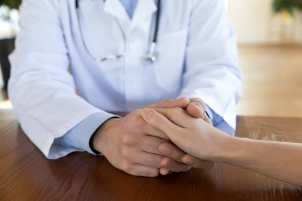 istock Caring compassionate physician comforting upset woman. 1317036389