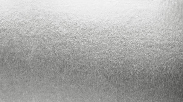 istock Silver background metallic texture wrapping foil paper shiny white grey metal backdrop for wall paper decoration element 1317039508