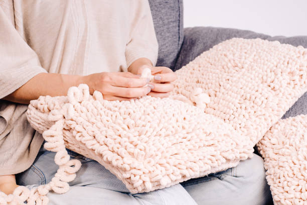 istock Knits made from thick soft yarn. Soft knitted cushions made of thick yarn. 1317039896