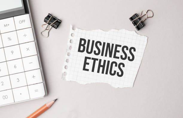 istock Business concept. Notebook with text BUSINESS ETHICS sheet of white paper for notes, calculator, glasses, pencil, pen, in the white background 1317040000