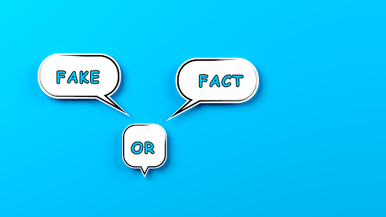 Speech bubbles with fake or fact text. On blue colored background. Horizontal composition with copy space