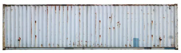 Photo of Wall of a steel gray old rusty sea cargo container. Isolated