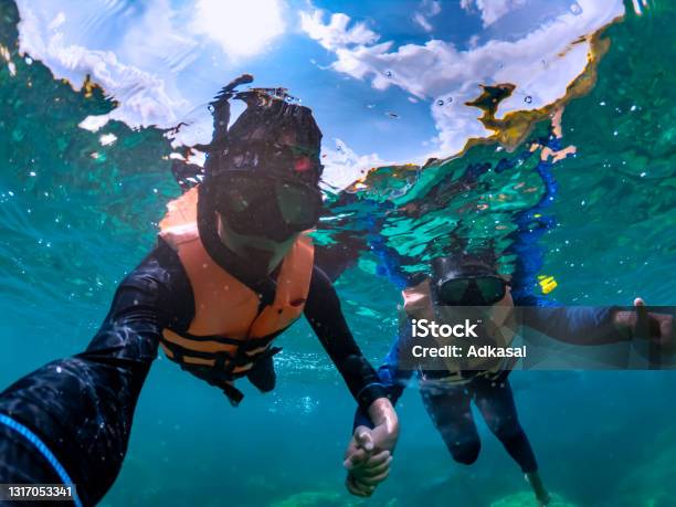 Happiness Couple Taking Selfie Under Tropical Sea Stock Photo - Download Image Now - Snorkel, Selfie, Diving Into Water