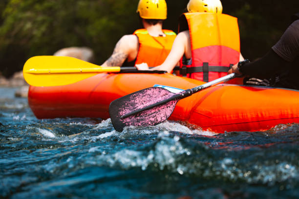 istock Young people rafting on the river turbulent flow 1317053945