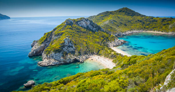 Porto Timoni beach, Corfu, Ionian Islands, Greece High angle view on beautiful Porto Timoni beach in Corfu. Located in the Ionian Sea of Greece the idyllic beach is surround by crystal clear turquoise water. ionian sea photos stock pictures, royalty-free photos & images