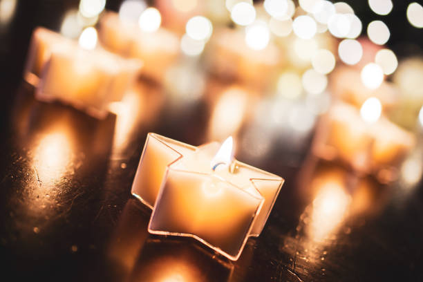 Relaxing Tealight In Star Shape With A Bokeh Of More Candles