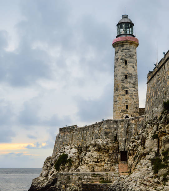 El Morro Old Havana bay lighthouse, Cuba Lighthouse next to La Cabaña Fort build by the Spanish Colonialism in La Havana bay in Cuba morro castle havana stock pictures, royalty-free photos & images