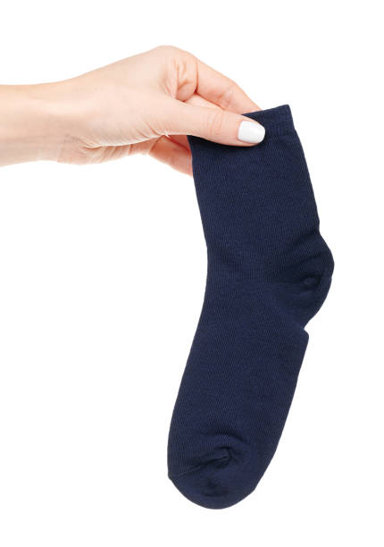 istock Hand wtih dark blue cotton socks isolated on white background 1317074911