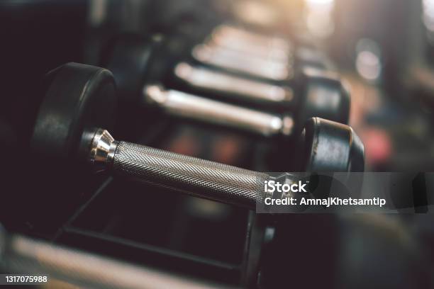 Close Up Of Dumbbells Placed At The Gym Stock Photo - Download Image Now - Weights, Gym, Close-up