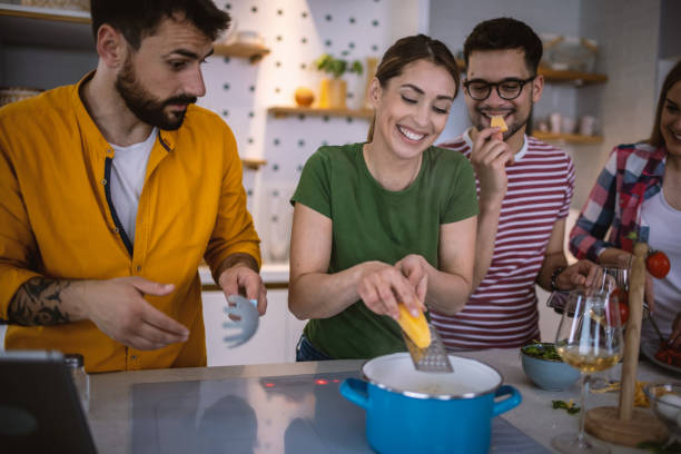istock Friends Cooking Together 1317076698