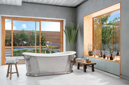 Bathroom With Bathtub, Wood Stool And Potted Plant. Garden View From The Window.