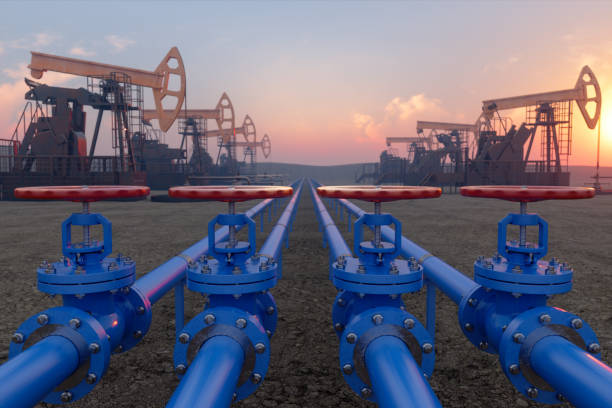 petrochemical plant with blue pipe line valves on soil and pumpjacks - plataforma petrolífera imagens e fotografias de stock