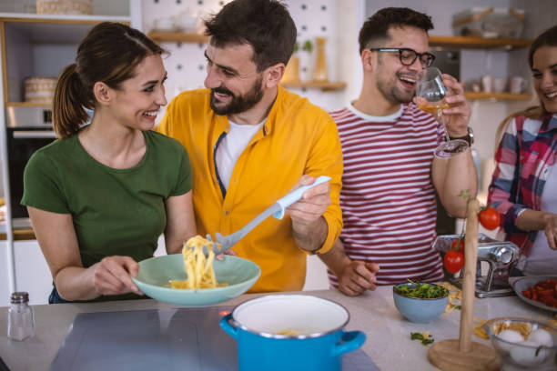 istock Friends Cooking Together 1317076756