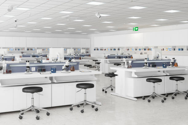 istock Science Laboratory With White Desks, Microscopes And Other Scientific Equipments 1317076777